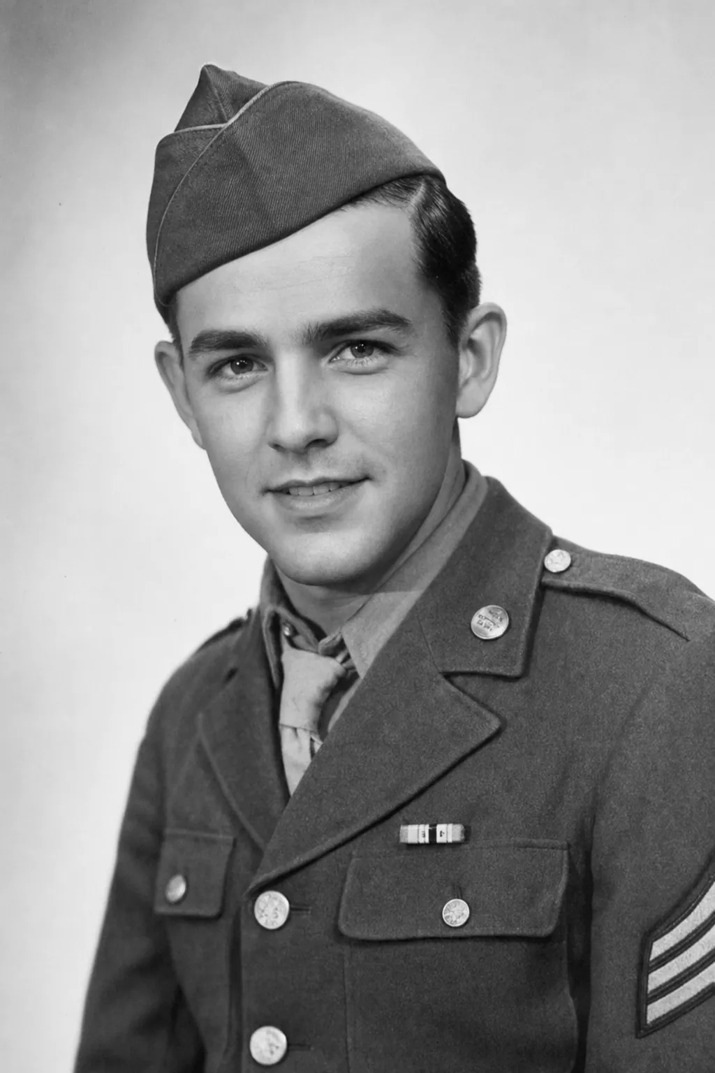 A restored 1944 soldier portrait, clean monochrome